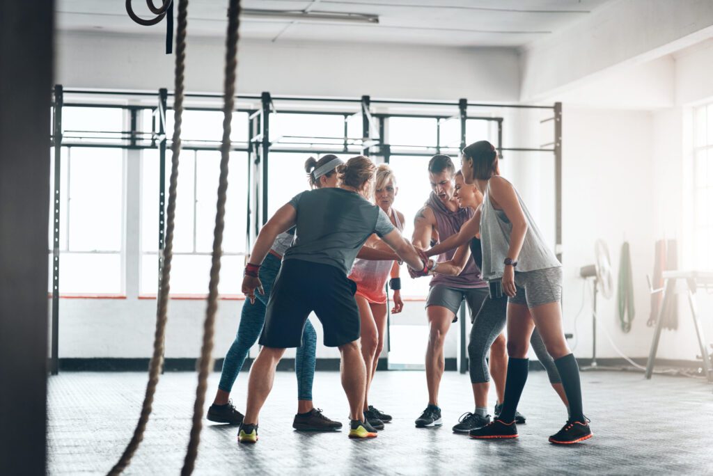 Were in this together. Shot of a fitness group working out at the gym.